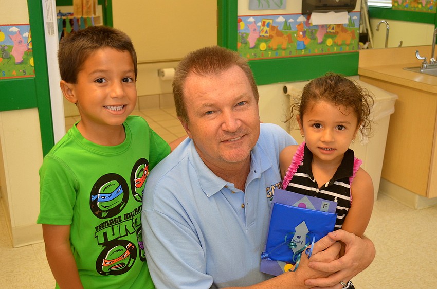 John Cronen flanked by Jake and Vicky Cronen.