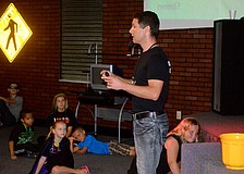 Church Pastor Jon Clauson leads a Bible lesson.