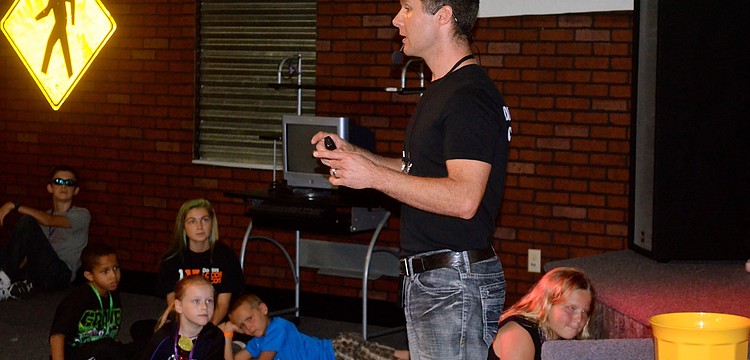 Church Pastor Jon Clauson leads a Bible lesson.