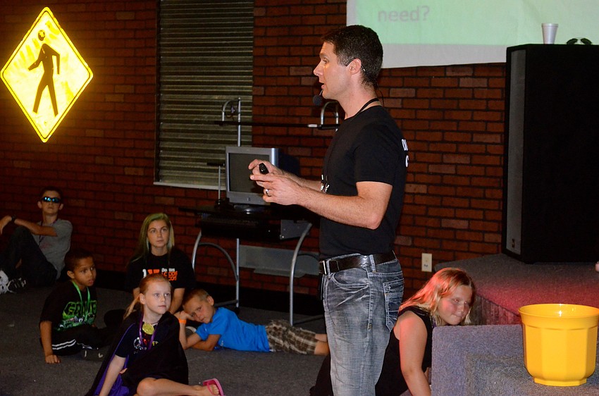 Church Pastor Jon Clauson leads a Bible lesson.