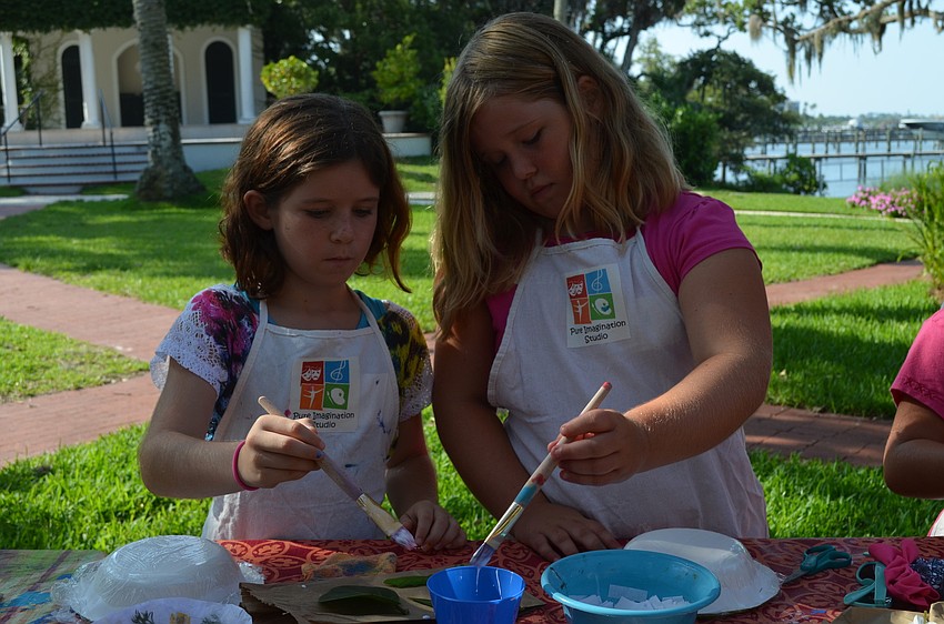 Layla Brownell and Kylie Gill use the glue.