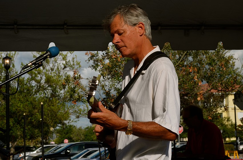 Mark Fox plays the guitar.