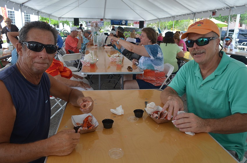 Frank English and Dennis Robertson try lobster.