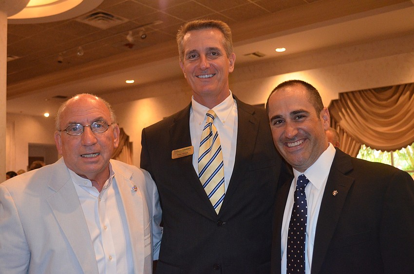 Norm Schimmel, Peter Abbott and City Commissioner Paul Caraguilo