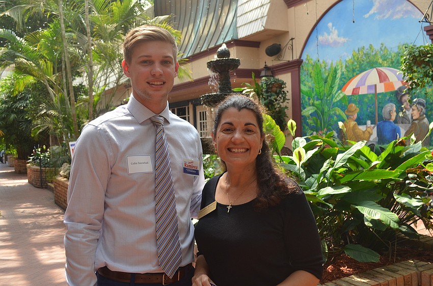 Colin Snowball and Lourdes Ramirez greet guests.