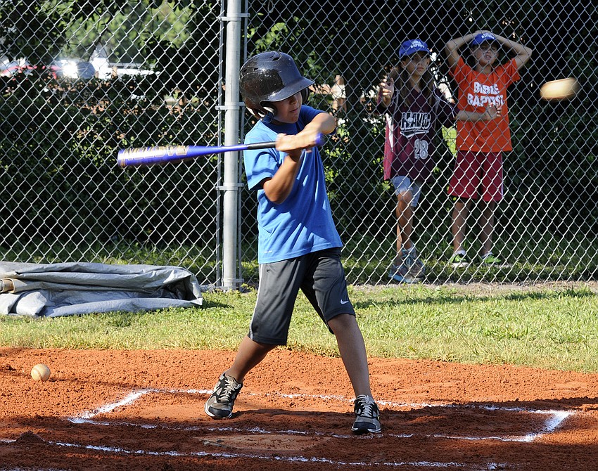 Ten-year-old Eli McKellar looks to make contact during the first inning.