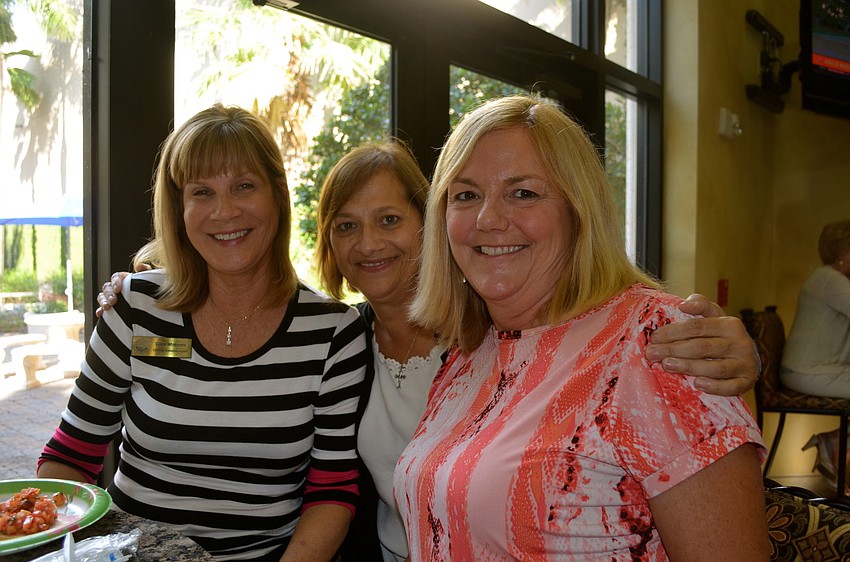 County Commissioner Carol Whitmore, Linda Peters and Patti Duff make small talk.