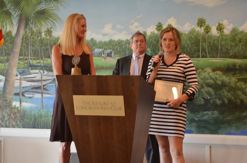 Gabrielle Doraisamy, Southeastern University, is awarded a technical scholarship by Scholarship Committee Chair Susan Philips and Longboat Kiwanis Club President Richard Crawford.