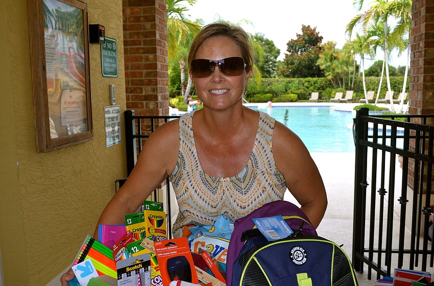 Event organizer Cammy Milner gathers supplies to donate.
