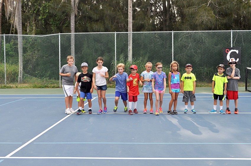 The kids begin the day with fun warm-ups around the court.