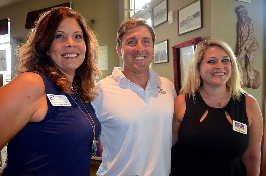 Lindsey Leech, Doug McDuffie and Bethany Willats share laughs before dinner.