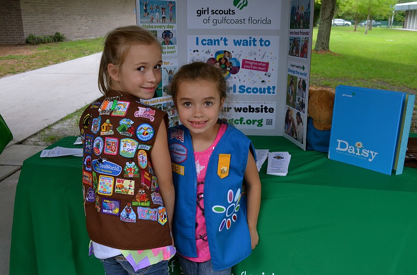 Sisters Lauren and Katie Costello show off their badges.
