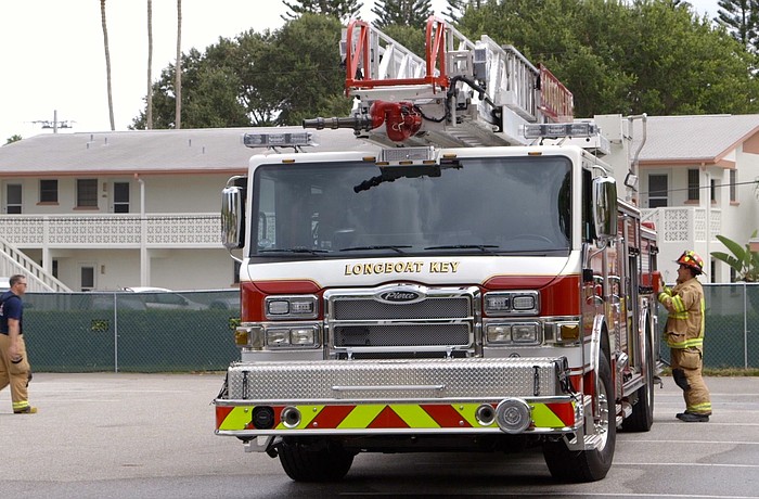 Longboat Key Fire-Rescue trucks begin practice drill Friday outside the former Longboat Key Hilton.