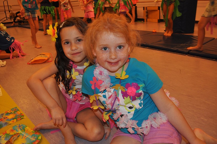 Luisa Kosar and Olivia Michaels feast on pizza.