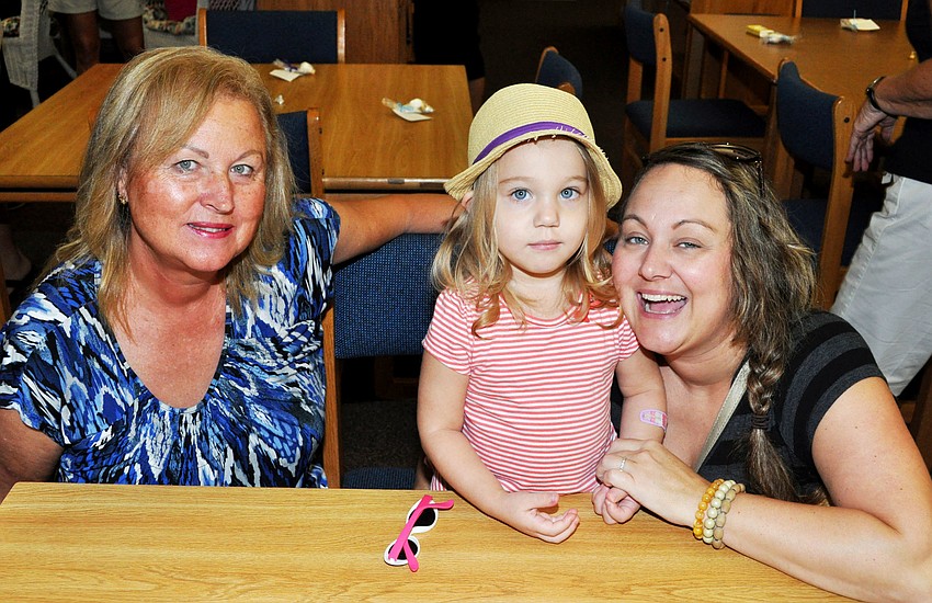 Mila Garcia with Mila Ortiz and her mother Maria Garcia enjoy breakfast in the library after dropping off brother Matias to his first day of kindergarten.