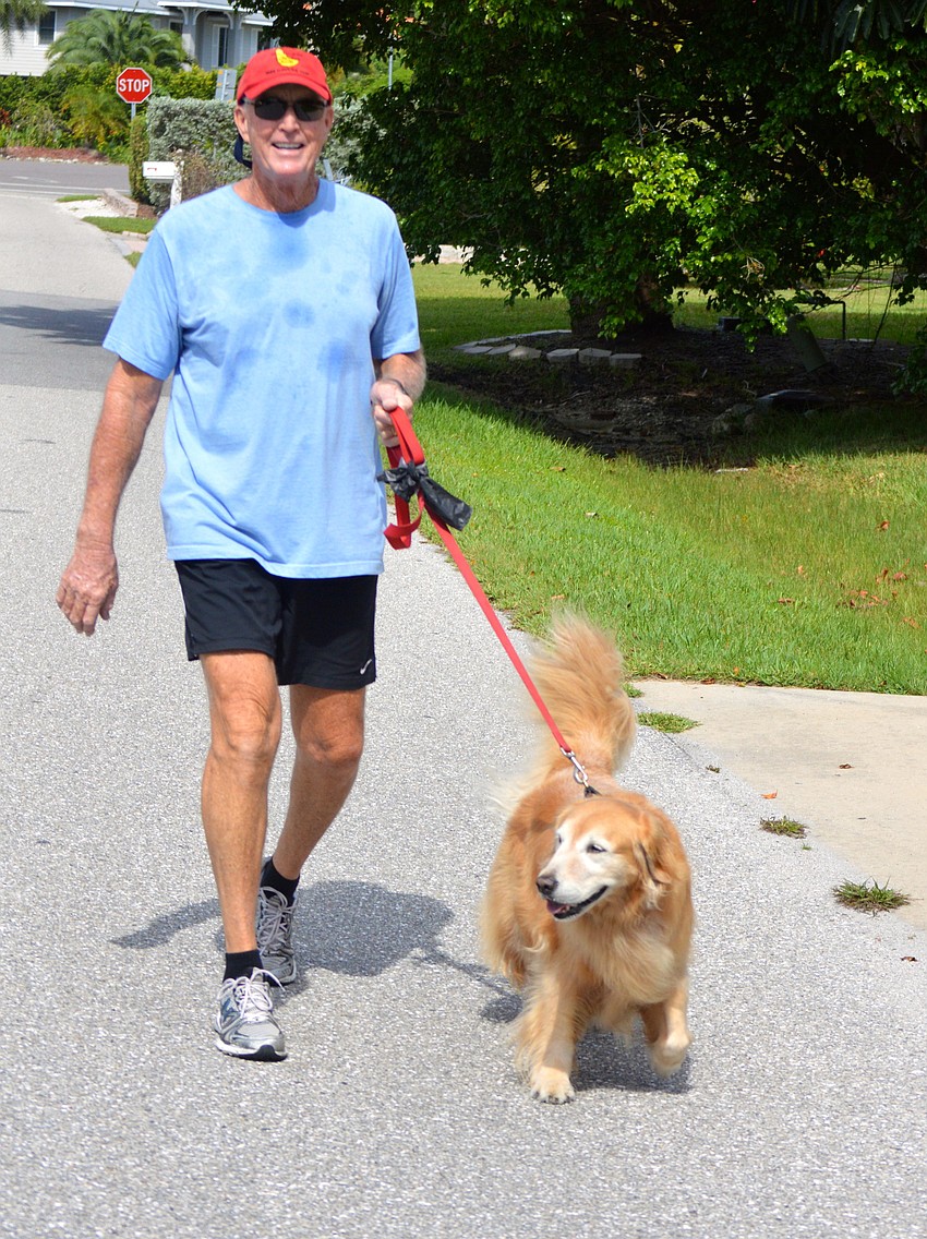 Bill Dooley takes a Sunday morning stroll with his 9-year-old golden retriever, Lucky. The two walk together every day, or, as Dooley puts it, â€œItâ€™s more like she takes me for a walk.â€
