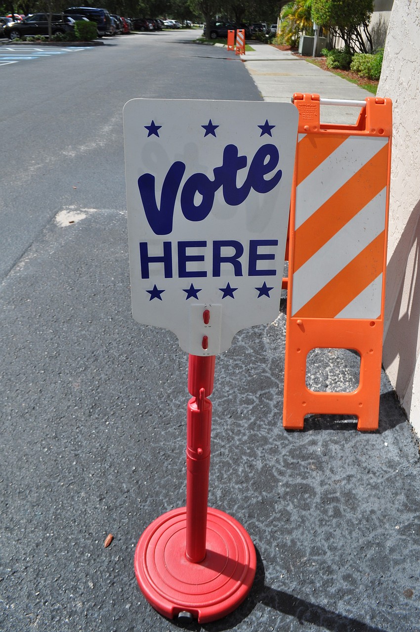 Signs encourage voters to come out.
