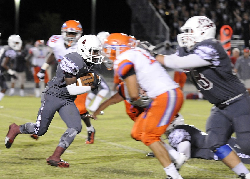 Braden River sophomore running back Raymond Thomas carries the ball for a first down in the second half.