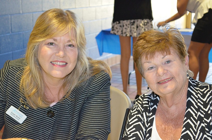 Arts and Cultural Alliance operations manager Susan Burke and volunteer Fran Sadlo greet attendees at the Lee Wetherington Boys and Girls Club.