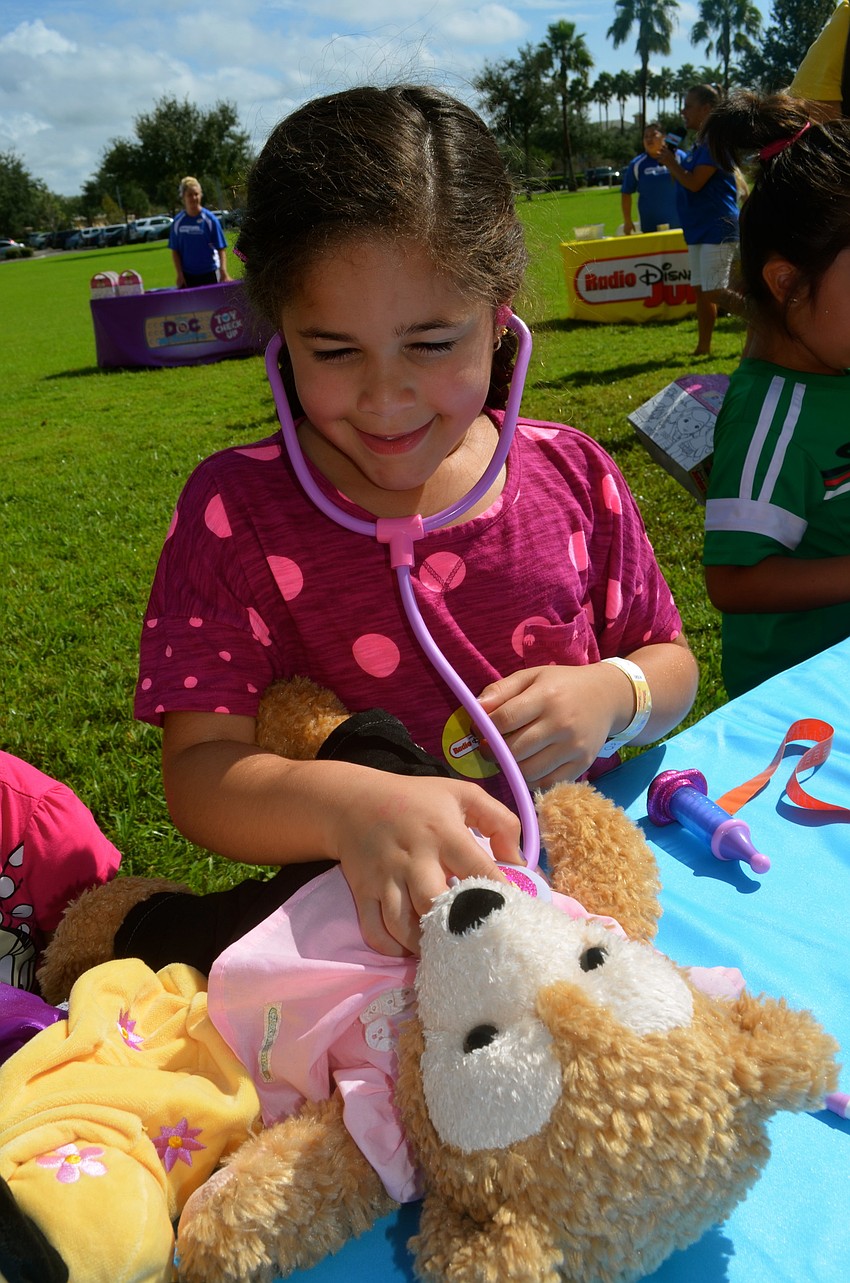 Maliyah Jenkins checks the heartbeat of her friend, Beary.