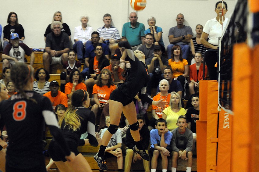 Sarasota senior outside hitter Jordan Brooks sends the ball back over the net during the first set.