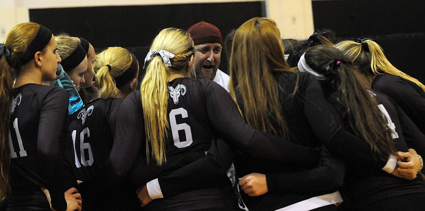 Riverview head coach Joe Rohr encourages his players following their victory over Sarasota in the first set.