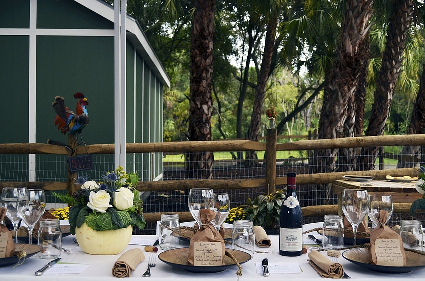 A table set for 14 guests was set up at Sweetgrass Farms for the Maison Blanche Farm to Fork lunch event.