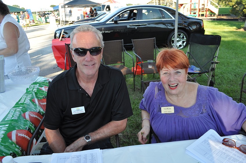 Tony Dempsey, of Sunstate Business Brokers, and Janet Arena, of the Van Wezel Performing Arts Center, check in guests.