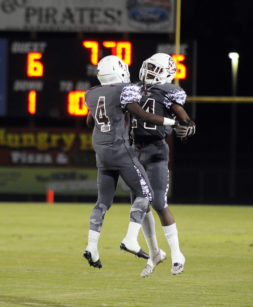 Braden River running backs Raymond Thomas and Carlos Crawford celebrate following Crawfordâ€™s 1-yard touchdown run to open the second quarter.
