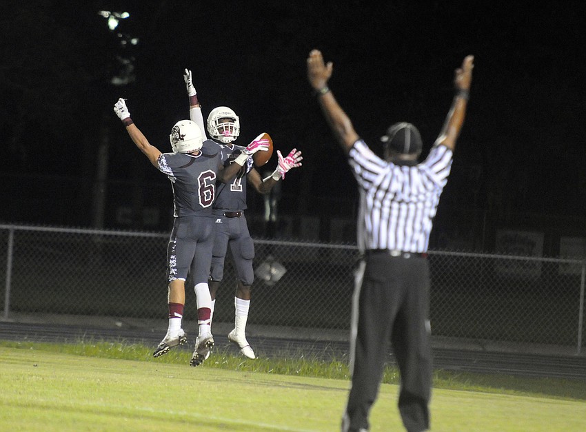 Wide receivers Travis Williams and Justin Ross celebrate following Rossâ€™ third touchdown catch.