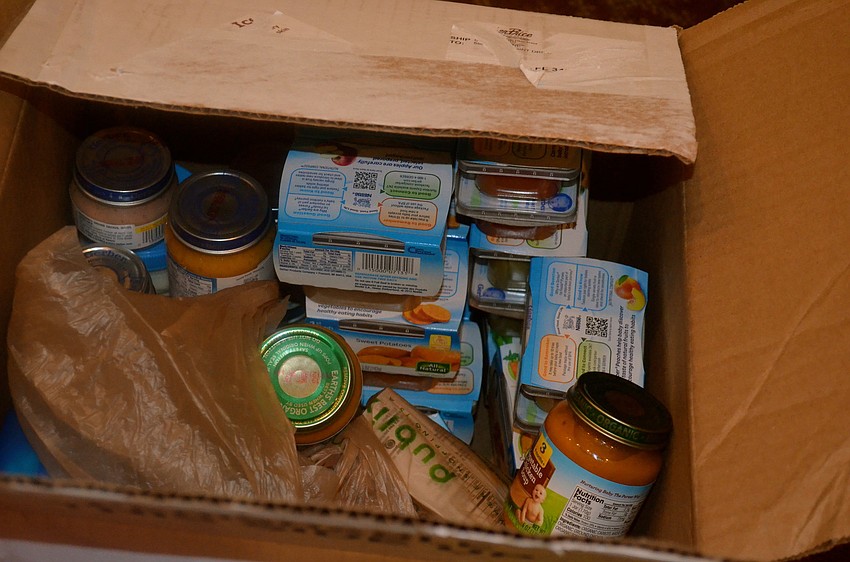 Palm-Aire Women's Club members brought donations for the Food Bank of Manatee.