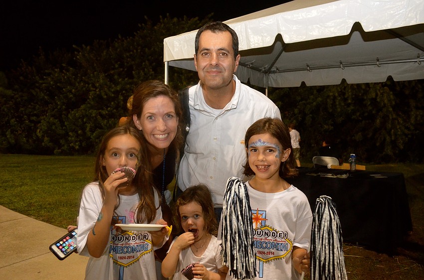 Susan and Chris Yancy smile beside Darcey Skelton, and Caroline and Juliet Yancy.