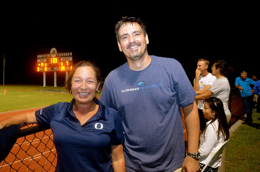 Avery Dodge and Glen Bleau cheer from the sidelines.