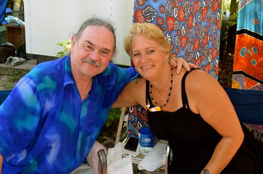 Tom Worthington and his daughter, Jan Bucik offer massages at their booth.