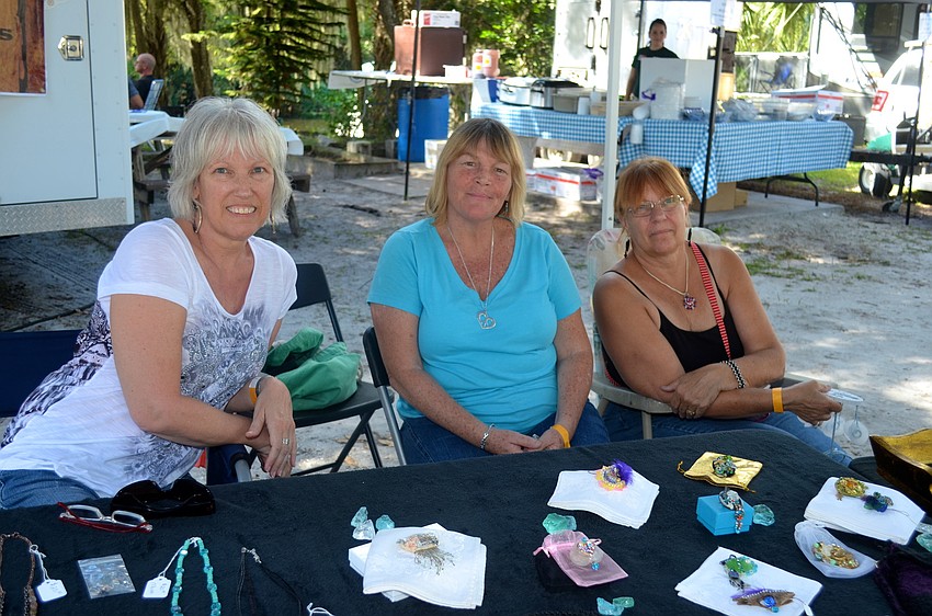 Kathy Banks, Jane O'Brien and Nancy Vejrostek sell jewelry at their booth.