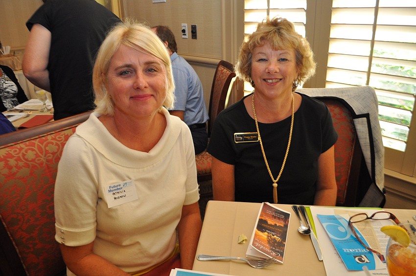 Patricia Robson, of Primerica, sits with Peggy Shafer, of Century 21.