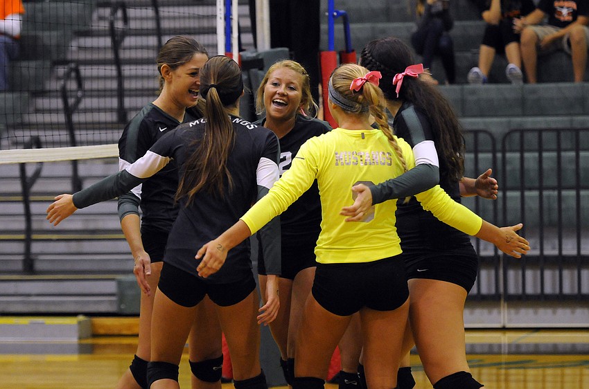 The Lakewood Ranch High volleyball team celebrates a point during its 3-0 victory over Sarasota in the Class 7A-District 10 championship Oct. 23.