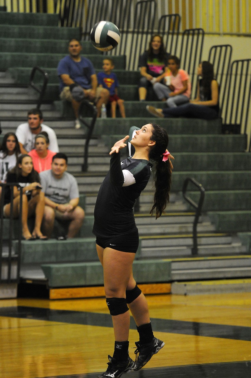 Kahlee York serves the ball for Lakewood in the first set.