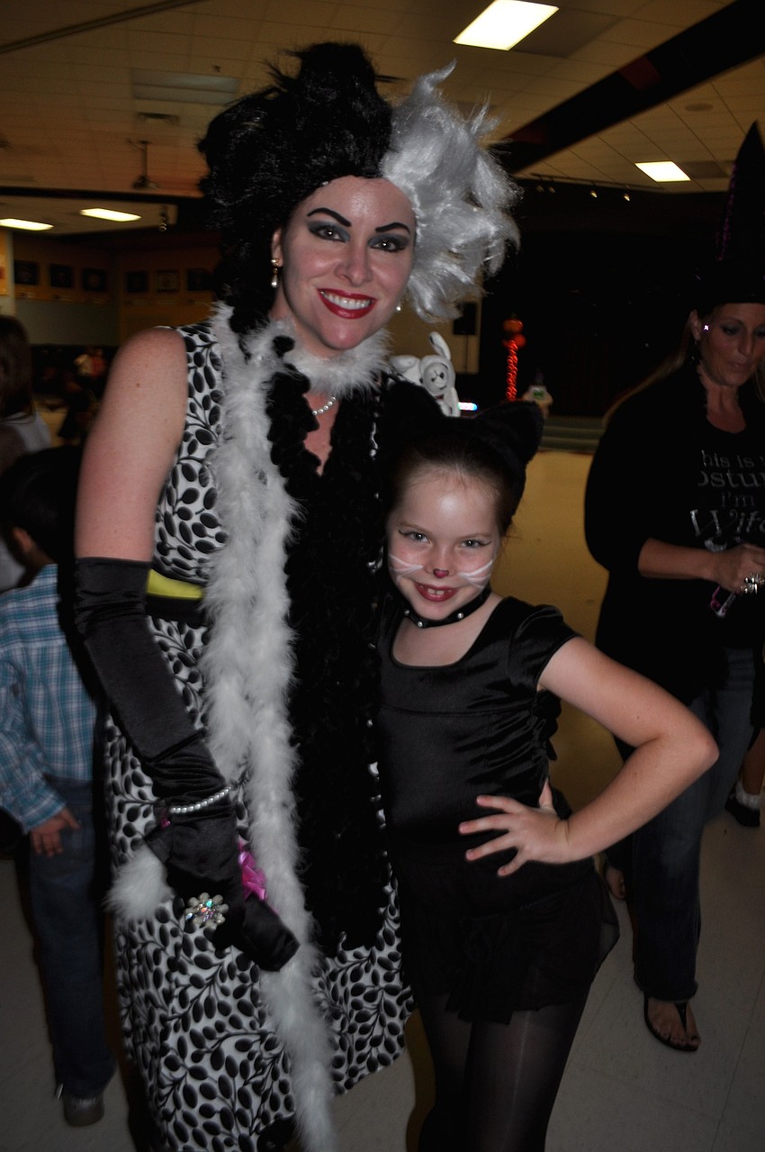 Kerri Martin, as Cruella de Vil, attends with her daughter, Delaney, 7.