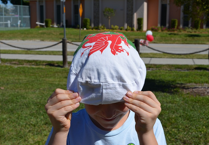 Johnny Garrison shows off his hat with a Welsh flag design.