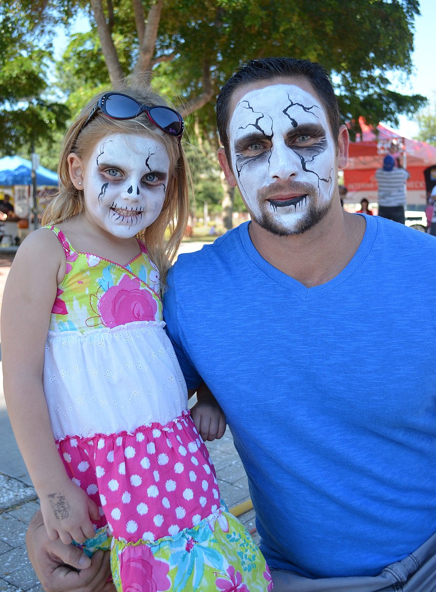 Kylee and her father Adam Brantley had their faces painted at the Sarasota Pumpkin Festival.