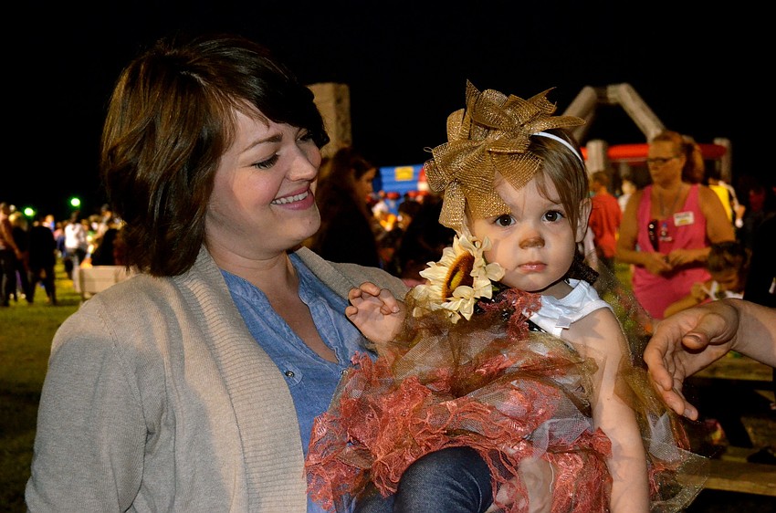 Amy Dunham and her daughter, Claire, enjoy a cool night outside.