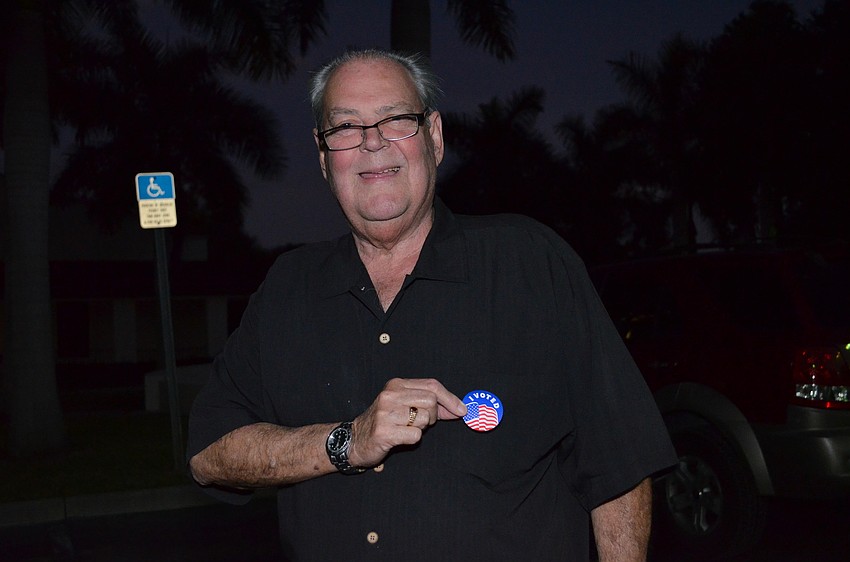 Dan Clark proudly wears his â€œI Votedâ€ sticker after voting for the Midterm election.