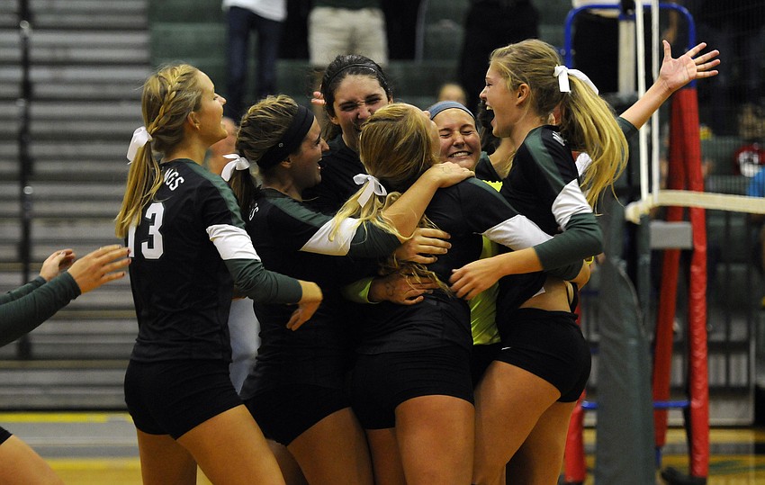 The Lakewood Ranch High volleyball team celebrates following its 3-1 victory over Sarasota in the Class 7A-Region 3 semifinals Nov. 4.