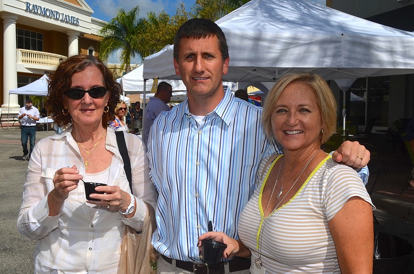 Pattie Howell, Peter Geaglone and Kim King finish eating their soups.