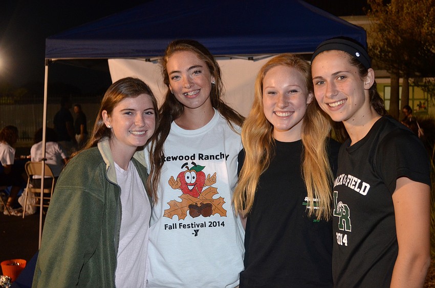 Event volunteers Katie Wray, Elizabeth Chandler, Julia Harrison and Kailyn Scully oversee games at the event.