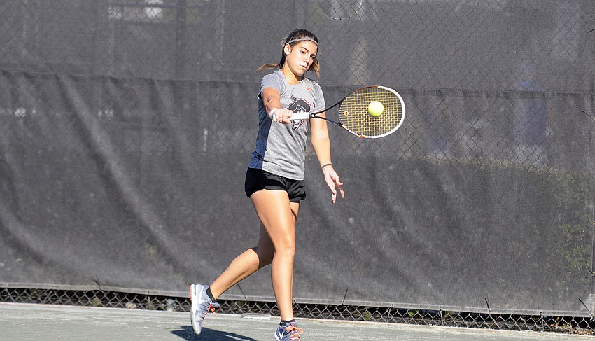 Oklahoma State sophomore Maria Alvarez sends the ball back over the net.