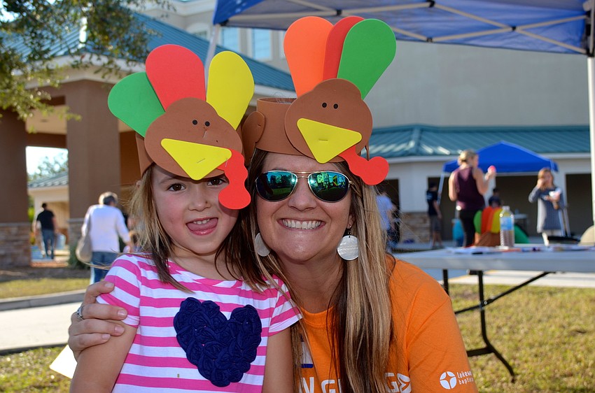 Cora Wells and Ashlie Fulmer show off their Thanksgiving-themed accessories.