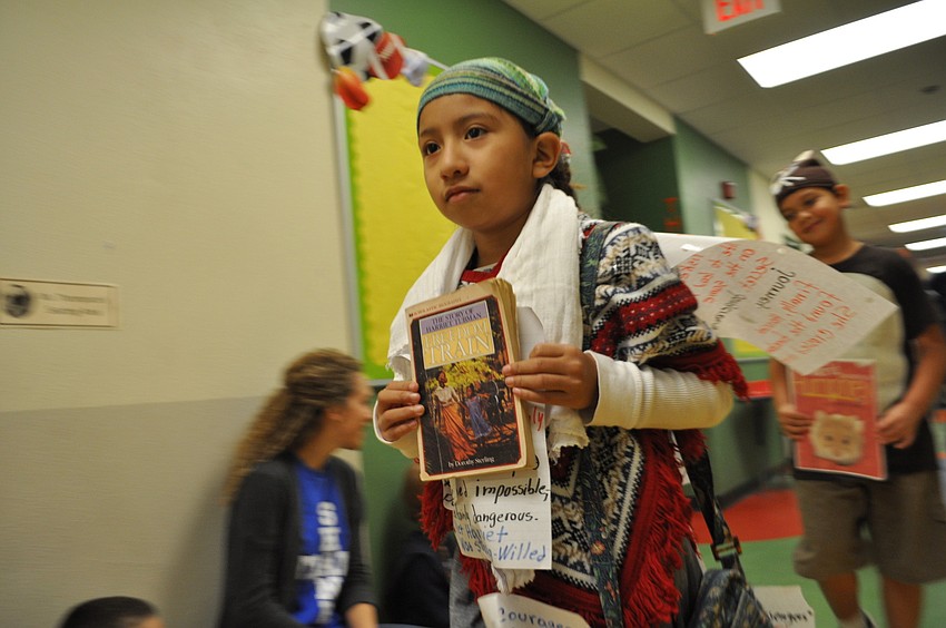 Sophia Garcia walks as Harriet Tubman.