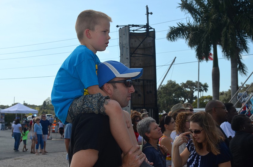 Gavin Perkowski watches the circus show from the best seat in the crowd â€”Â his father, James', shoulders.